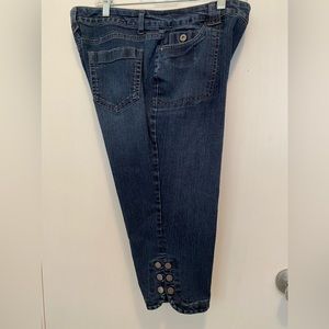 Worn dark blue denim crop pants
